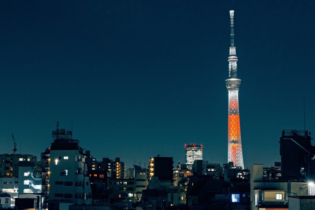 tokyo tower vs. tokyo skytree. tokyo skytree illuminated at night