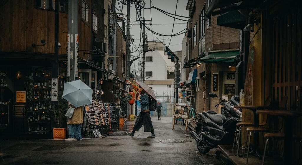 Woman on the street with an umbrella. Best 3-day Tokyo itinerary off the beaten path